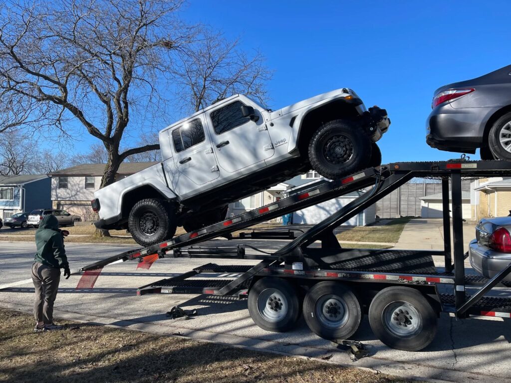Open car trailer used for car shipping Chicago Atlanta