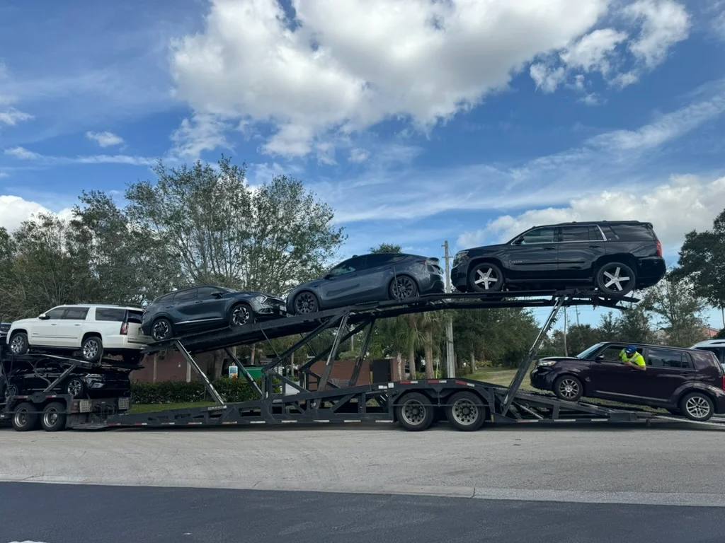 Open car carrier in San Diego loading a vehicle